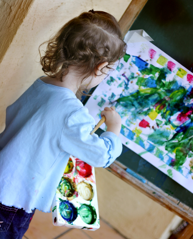 Preschool girl painting