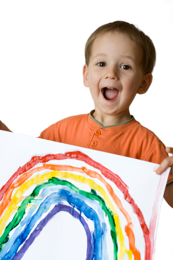 Happy boy and rainbow drawing