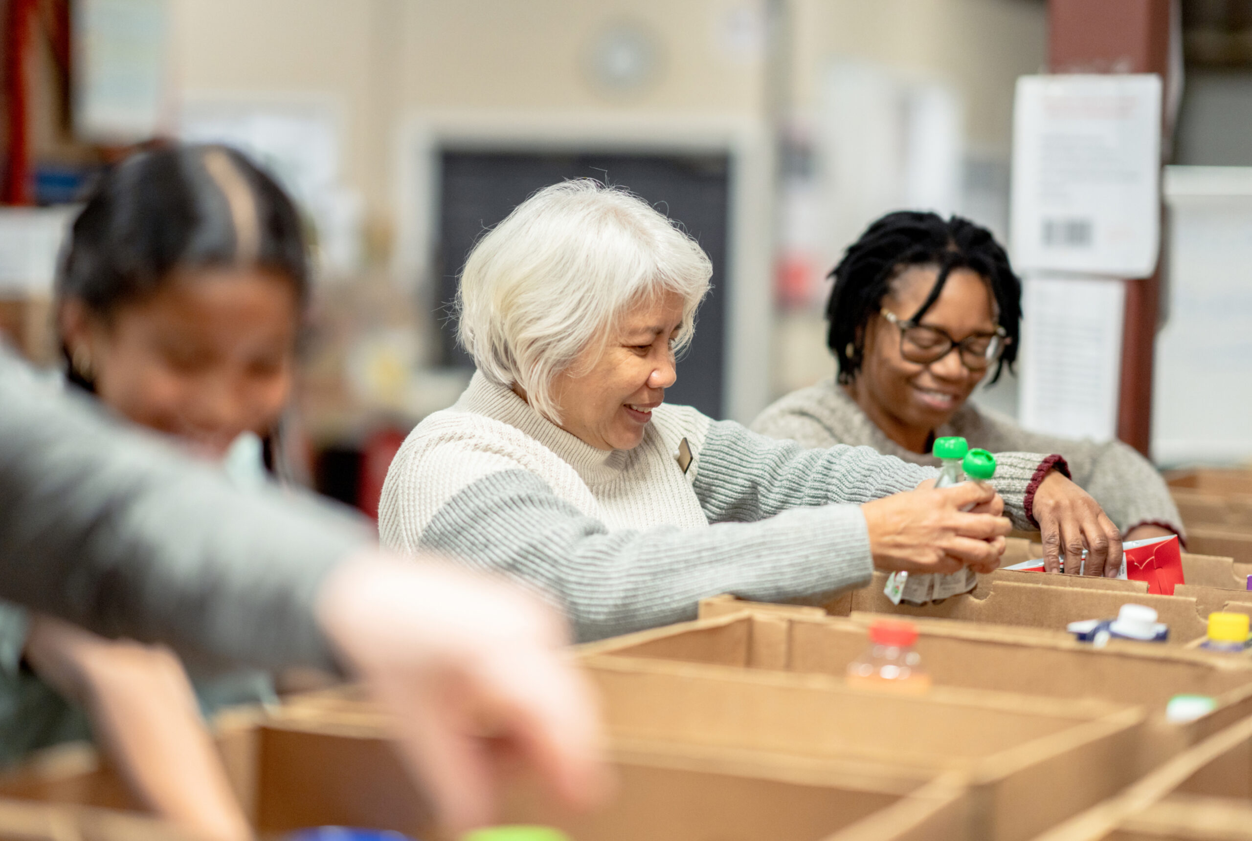 Volunteers packing at local food bank