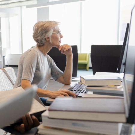 Focused senior woman computer