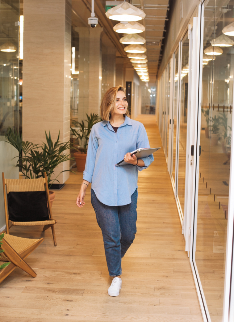 Female staffer walking to meeting