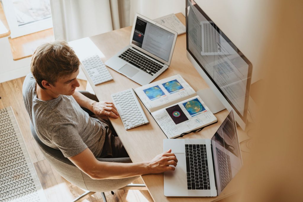 Person working on their computer from their home office set-up