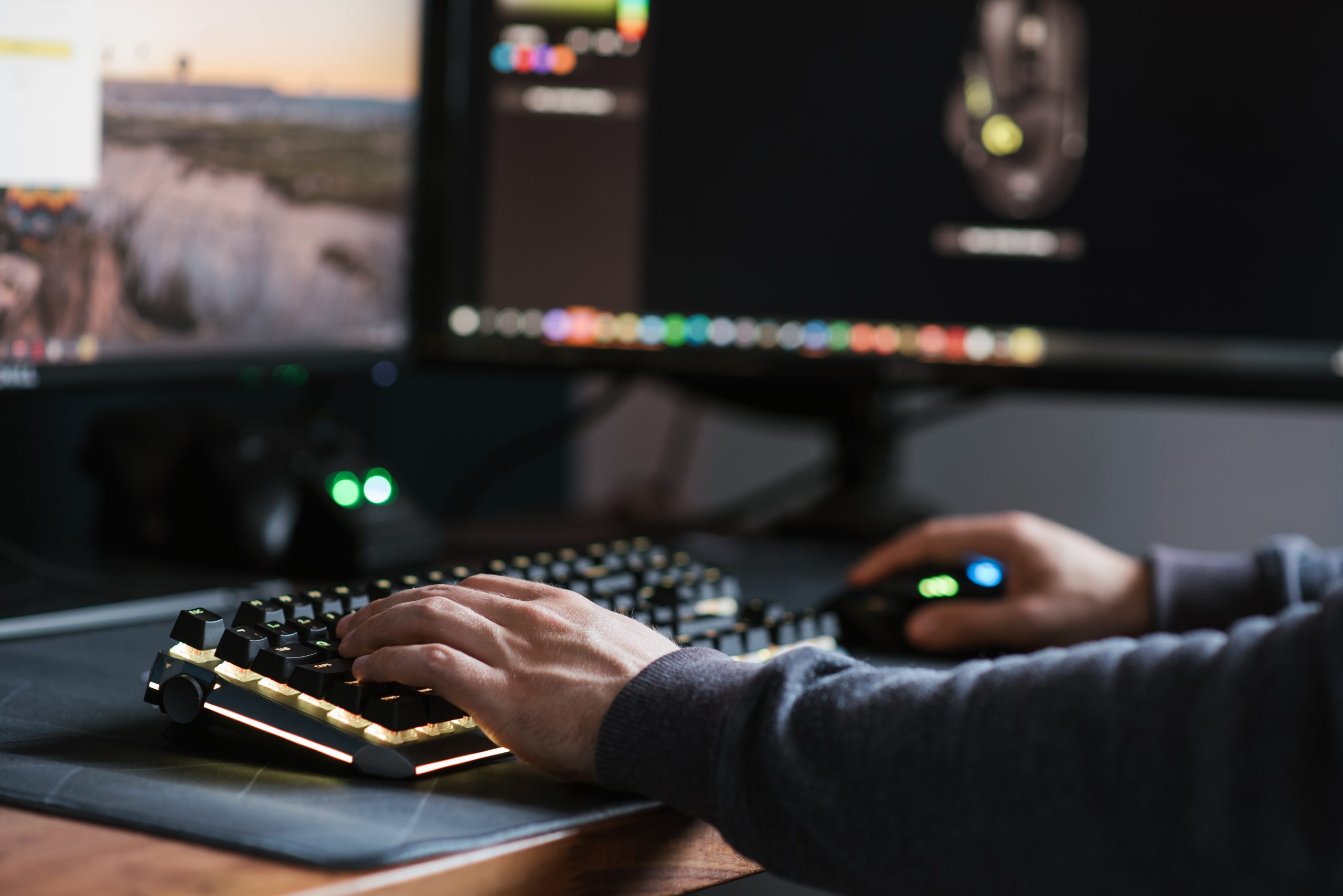 man typing on computer keyboard