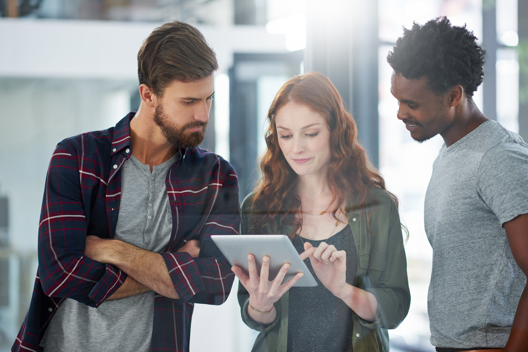 People looking at a tablet