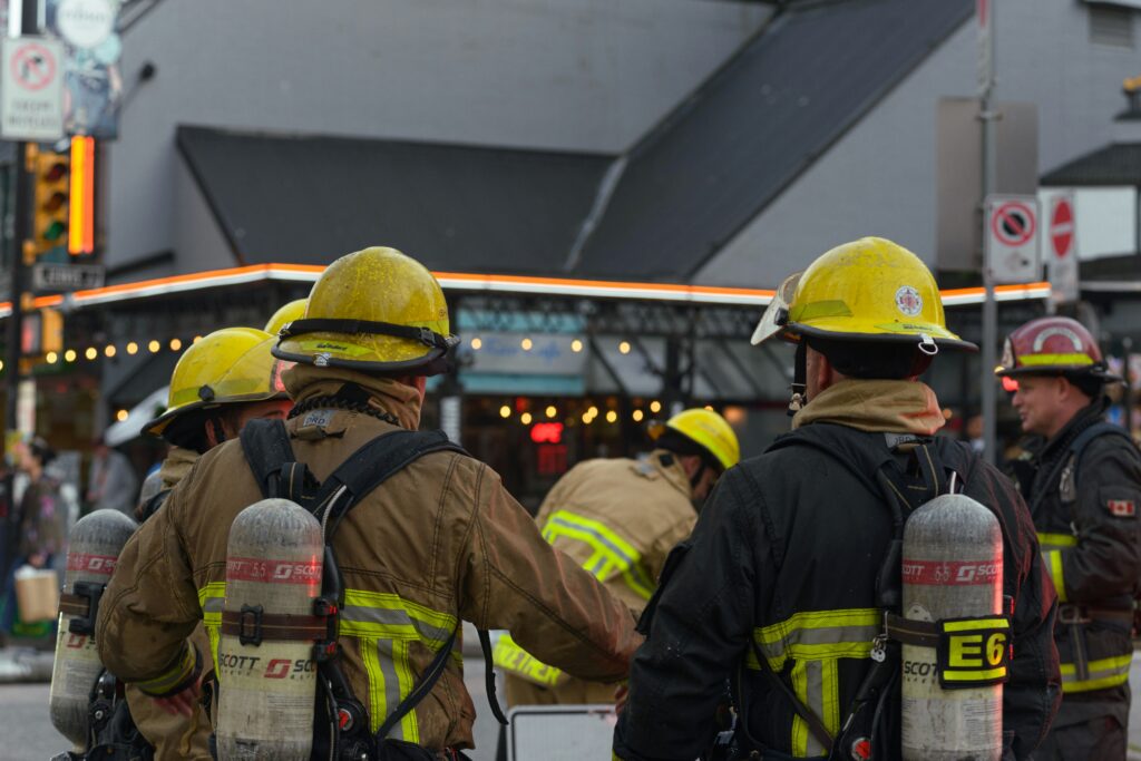 fire fighters stand side by side