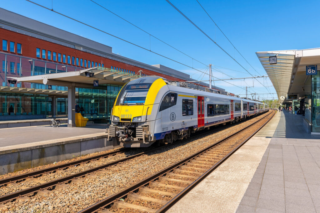 Train on a railroad platform in Belgium