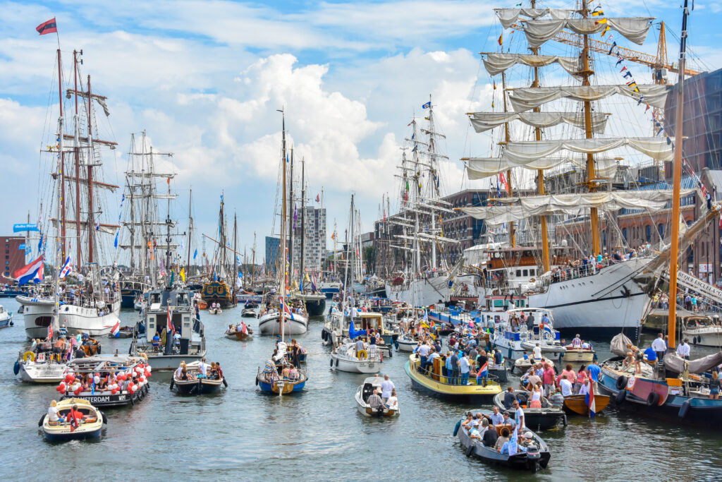SAIL Amsterdam brings together ships and visitors to celebrate maritime heritage along the IJ River.