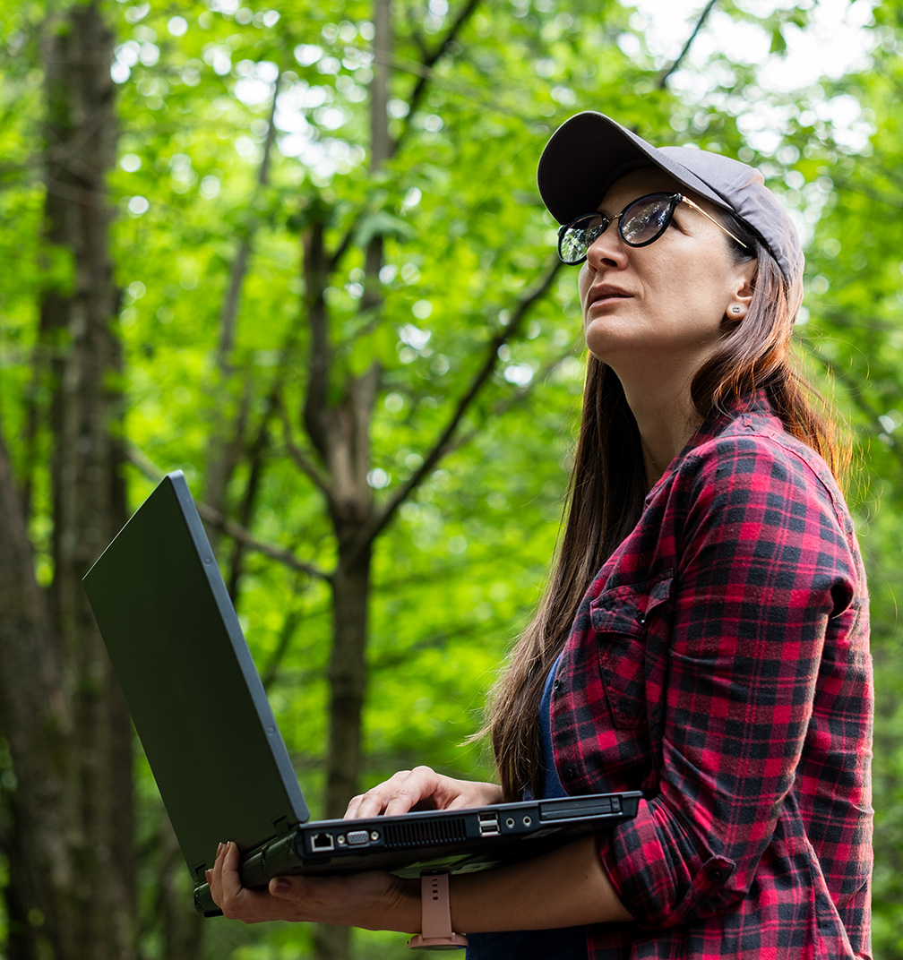 Woman forest humanitarian laptop